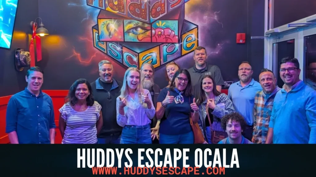 People inside a huddyescape smilling with text overlay on the bottom saying huddys escape ocala and site url